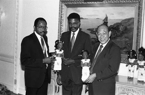 Men displaying Black dolls at the Bel Age Hotel, Los Angeles, 1986