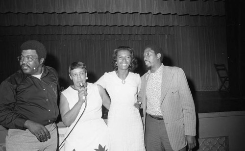 Doris A. Davis standing with others on election night, Compton, 1973