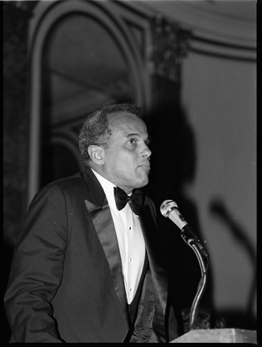 Harry Belafonte speaking at the TransAfrica and Artists and Athletes Against Apartheid benefit, Los Angeles, 1985