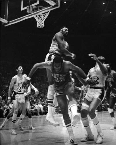 Wilt Chamberlain jumping near a hoop, Los Angeles, ca. 1970