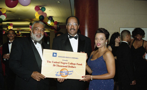 Deloria Jones posing with Victor M. Julien during the "A Midsummer's Night Magic" event, Beverly Hills, 1994