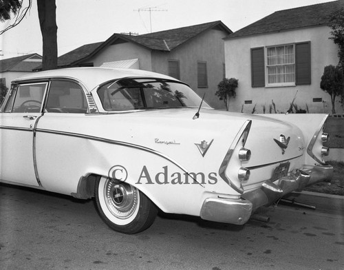 1956 Dodge Royal Lancer sitting on a neighborhood street, Los Angeles, 1962