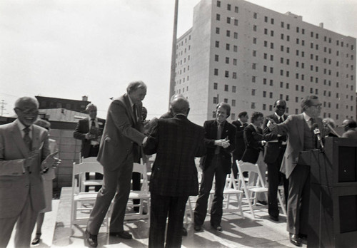 Rev. Thomas Kilgore, Tom Bradley and others gathering at a Community Redevelopment Agency project site, Los Angeles, 1981