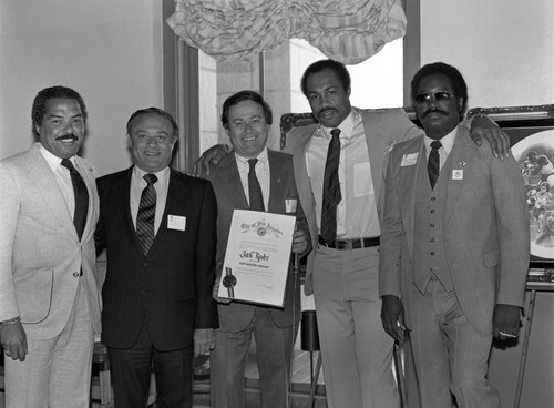 Jack Rodri and Ken Norton receiving a commendation at City Hall, Los Angeles, 1983