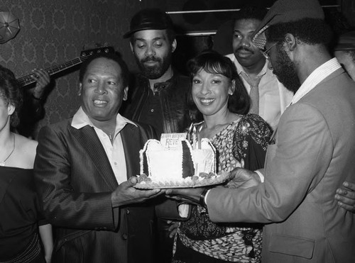 Reve Gipson holding her birthday cake at the Pied Piper nightclub, Los Angeles, 1984