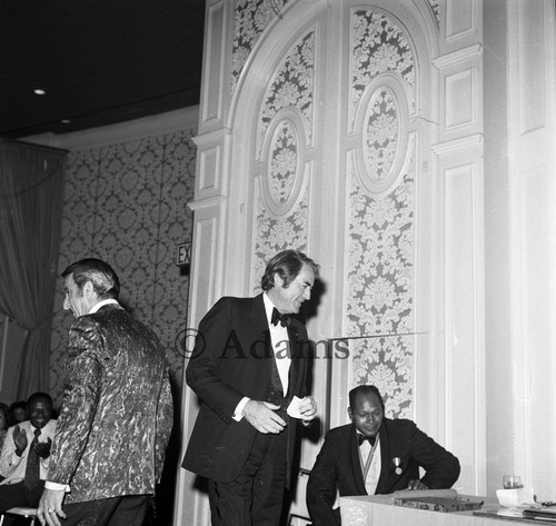 Gregory Peck standing near Tom Bradley during an event in his honor, Los Angeles, 1972