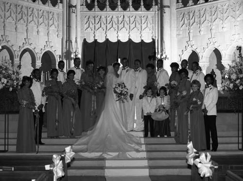 Darryl Strawberry and Lisa Andrews posing with their wedding party, Pasadena, 1985