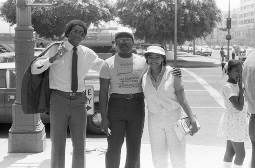 Kim Fields posing with Rev. Bill Minson near L.A. City Hall, Los Angeles, 1983