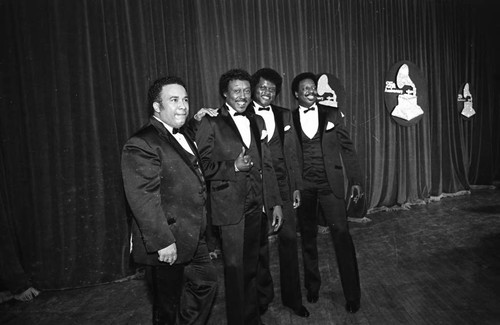 Members of The Spinners posing together at 25th Annual Grammy Awards, Los Angeles, 1983