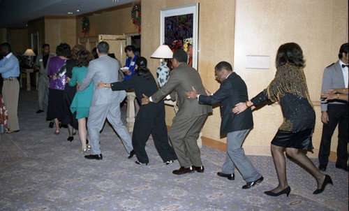 Atkins & Evans holiday party guests dancing, Los Angeles, 1994