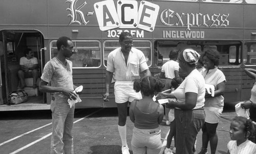 Bubba Smith talking with others during a Black American Response To The African Crisis promotion, Los Angeles, 1985