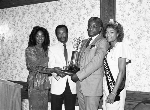 Willie Hall receiving a community service award, Los Angeles, 1986