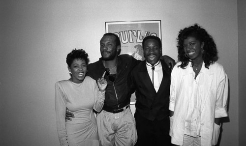 Anita Baker, George Howard, Donnie Simpson, and Natalie Cole posing together at the 11th Annual BRE Conference, Los Angeles, 1987