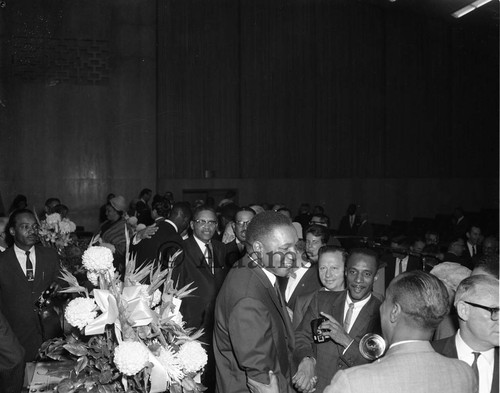 Man speaking to reporters, Los Angeles, 1963