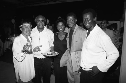 Brock Peters and Didi Peters posing with others at a Communications Bridge Institute event, Los Angeles, 1987