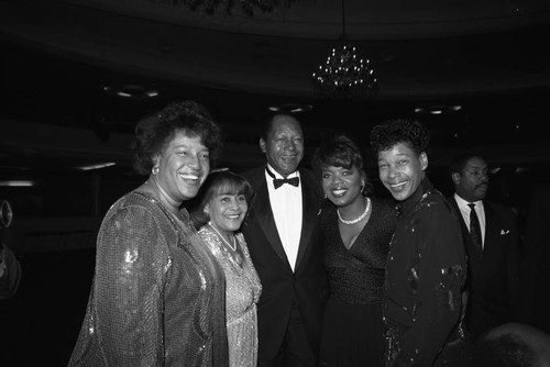 Bradley family posing with Oprah Winfrey at a Black Women's Forum event, Los Angeles, 1989