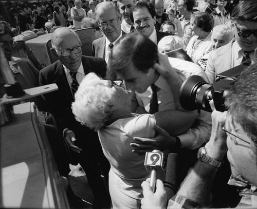 Jerry Brown receiving a greeting among a crowd, Los Angeles