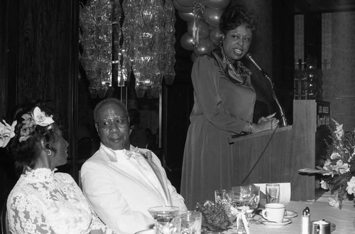 Diane Watson speaking from a lectern at the Bohana 50th wedding anniversary celebration, Los Angeles, 1984