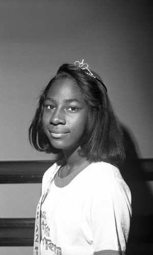 Kisha Lusk, candidate for Miss Preteen America, posing for the camera, Los Angeles, 1989