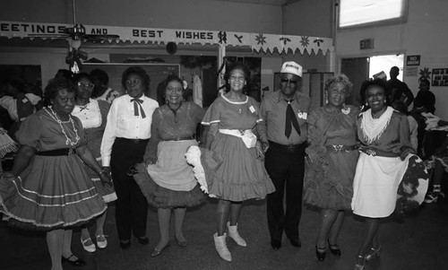 Van Meter Squares dancing group members posing together, Los Angeles, 1989