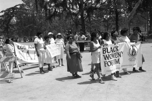 Community organizations walking in a parade at the Black Family Reunion, Los Angeles, 1989