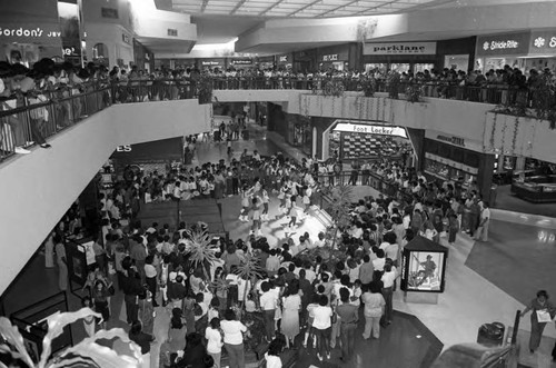 Spectators watching a Black History Month dance performance at a Mall, Los Angeles, 1982