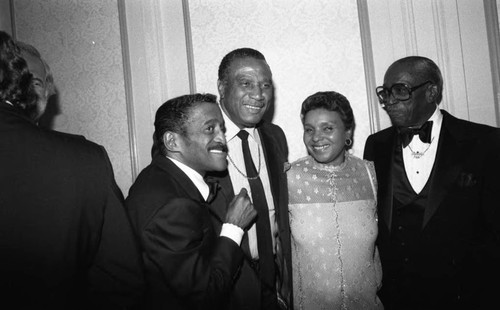 Sammy Davis, Jr. talking with George Rhodes, Shirley Rhodes, and Sammy Davis, Sr., Los Angeles, 1983