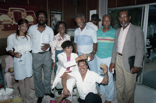 Donald Bohana posing with his family and others during his birthday party, Los Angeles, 1989