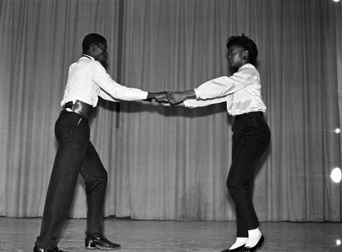 Couple dancing in a talent show at Dorsey High School, Los Angeles, 1983