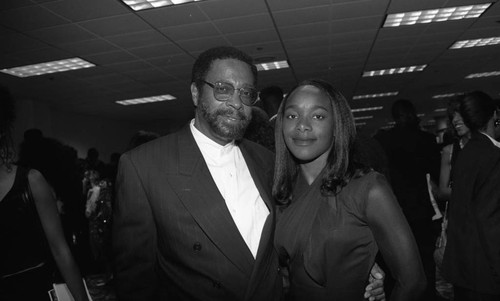 Couple posing together during "A Midsummer Night's Magic" dinner, Los Angeles, 1995