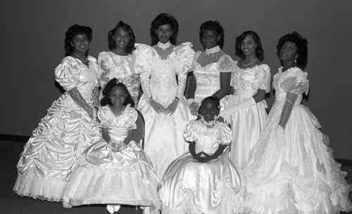 Young women and girls posing together in white gowns, Los Angeles, 1989