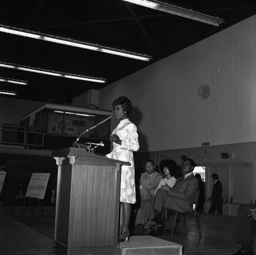 Shirley Chisholm speaking from a lectern at Compton College, Compton, 1972