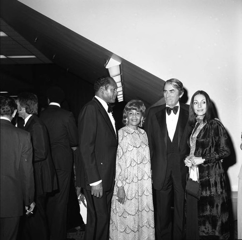 Tom and Ethel Bradley talking with Gregory and Veronique Peck at an event in Bradley's honor, Los Angeles, 1974