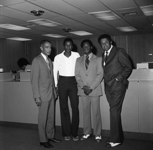 Don Newcombe, Al Downing, and Cornell Kirkland posing together at Enterprise Savings and Loan, Compton, 1973