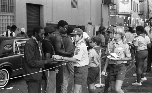 Friends feeding friends, Los Angeles, 1986