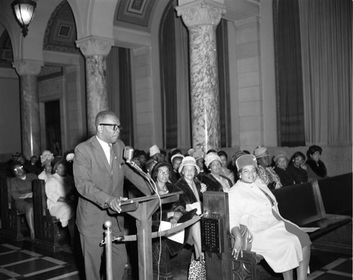 Man at podium, Los Angeles, 1964