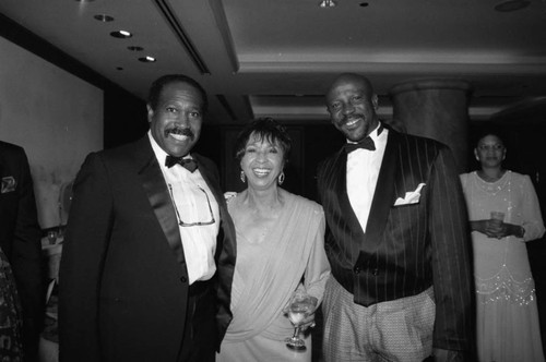 Black Emmy nominee Lou Gossett Jr. posing with Gertrude Gipson and Dick Griffey, Los Angeles, 1987