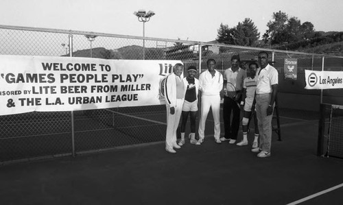 Sidney Poitier, John Mack, Franklyn Ajaye and Mike Weaver posing together at an Urban League event, Los Angeles, 1985