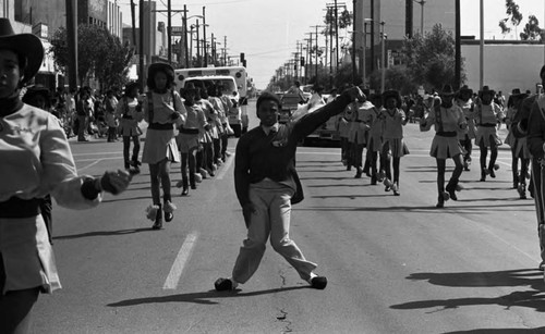 Drill team member performing during the South Central Los Angeles Easter Parade, Los Angeles, 1983