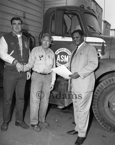 Men stand next to truck, Los Angeles, 1969