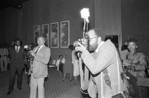 Photographers at work during the National Association of Black Journalists event, Los Angeles, 1982