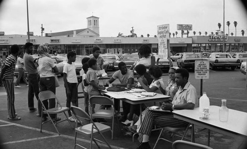 Voter registration in a shoping center parking lot, Los Angeles, 1972