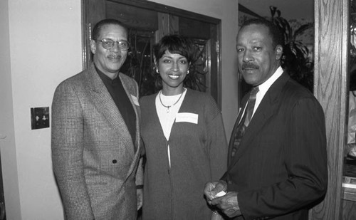 Reginald A. Dunn posing with guests at an event, Los Angeles, 1996