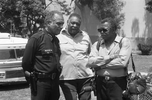 Jessie Brewer talking with Guy Crowder and Jim Cleaver at the Black Family Reunion event, Los Angeles, 1989