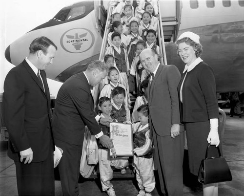 Councilman welcomes Korean children, Los Angeles, 1963