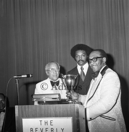 Brookins accepts award, Los Angeles, 1972