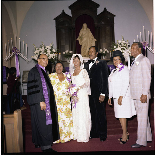 John Amos posing with his wife and others for a wedding portrait, Los Angeles, 1978