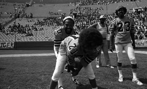 Marvin Gaye and Pam Grier playing in the Urban League's Celebrity All-Star Freedom Classic pre-game, Los Angeles, 1973