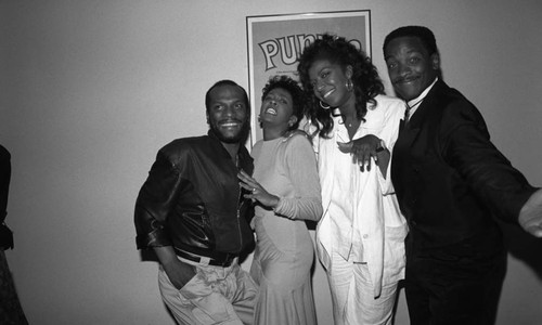 George Howard, Anita Baker, Natalie Cole, and Donnie Simpson posing together at the 11th Annual BRE Conference, Los Angeles, 1987