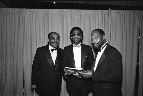 Al Green posing backstage with others during the 26th Annual Grammy Awards, Los Angeles, 1983